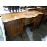 A Regency Style Breakfront Mahogany Sideboard On Tapered Supports