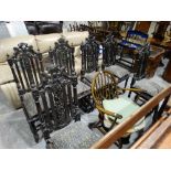 A Set Of Six Early 20thc Gothic Revival Style Chairs With Heraldic Carved Backs