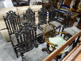 A Set Of Six Early 20thc Gothic Revival Style Chairs With Heraldic Carved Backs