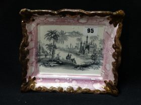 A Dixon Sunderland Pink Lustre Decorated Wall Plaque With Transfer Landscape & Figure Panel,