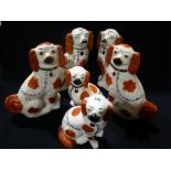 Three Pairs Of Late Staffordshire Pottery Red & White Seated Dogs