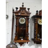 An Edwardian Pendulum Wall Clock With Circular Dial