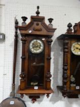 An Edwardian Pendulum Wall Clock With Circular Dial