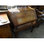 An Antique Oak Bureau With Single Drawer & Cabriole Supports