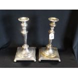 A Pair Of Square Based Sheffield Plate Candlesticks On Bun Feet, 12" High