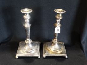 A Pair Of Square Based Sheffield Plate Candlesticks On Bun Feet, 12" High