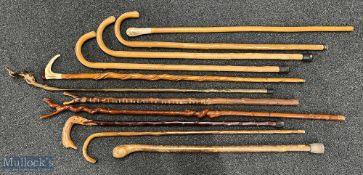 Walking Cane Stick Wading Stick collection - wooden sticks with noted items of a carved duck head,