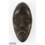 Carved African 'Dan' Dark Wood Mask with holes for eyes, nose and mouth, with holes to mask edge,