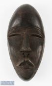 Carved African 'Dan' Dark Wood Mask with holes for eyes, nose and mouth, with holes to mask edge,