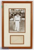 c1935 Don Bradman Cricket Photograph and signature underneath an image of The Don going out to bat