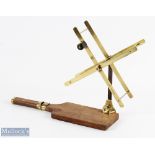 C Farlow brass folding line dryer on wood base, spring loaded arms on a steel shaft and brass