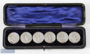 Early 20th century cased set of 6 White Metal Buttons each having a period golfer relief design to