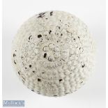 Kempshall Arlington Patent 17354 bramble pattern golf ball showing the maker's mark, with 7