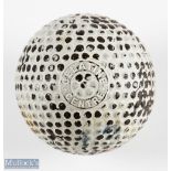 The Ace Gelatine Centre bramble pattern golf ball showing the clear maker's marks to both poles,