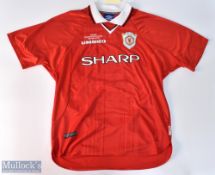 1997/00 Manchester United home football shirt in red, Umbro / Sharp, size XL, with UEFA Champions