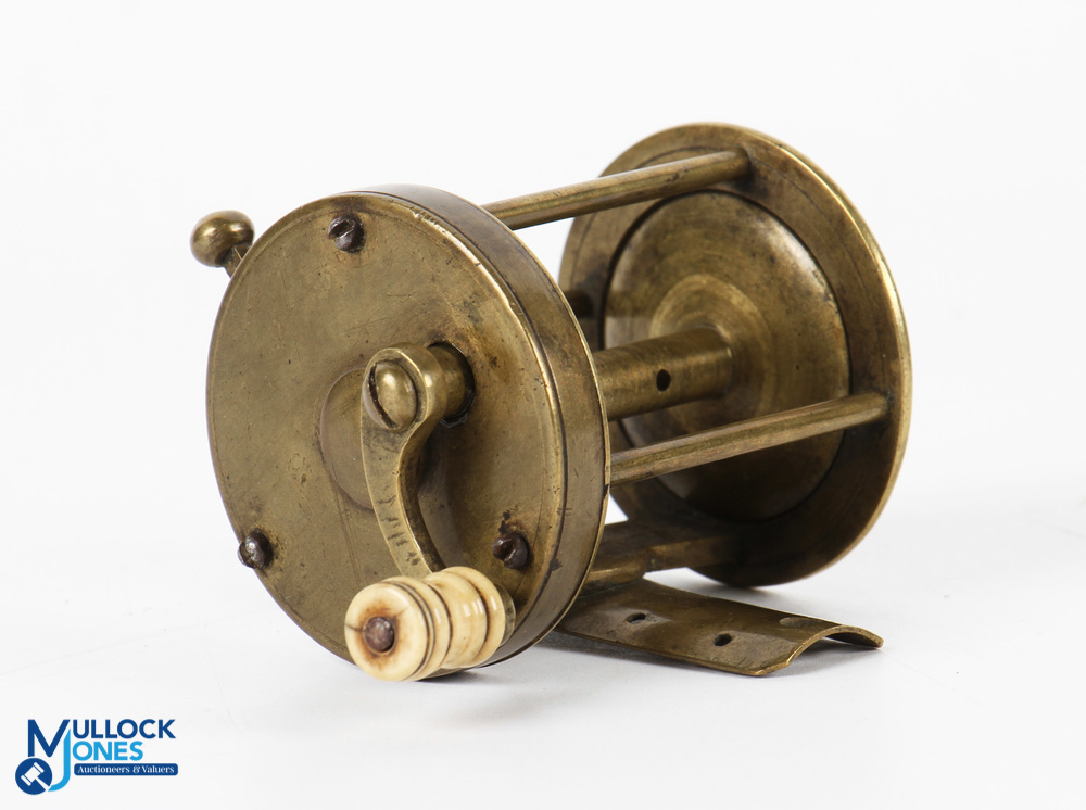 Very early brass multiplier winch with curved crank arm with white handle, rim mounted brass lever