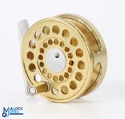 A fine Marryat Swiss made 2 5/8" fly reel with gold finish, button latch, rear tensioner, RHW, in