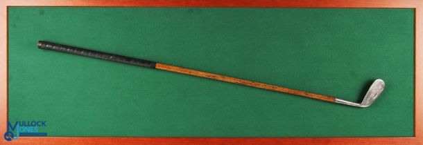 Display featuring a Robert Forgan of St Andrews flag mark EEZE No 2 iron attached to a green baize