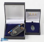 2003 PGA Cup Matches Silver Golf Set (2) - Garrard London Oval Silver Pin Badge in maker's case; and