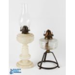 British Made Milk Glass Oil Lamp, with embossed flowers motif, brass fitting, with a glass lamp base