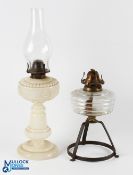 British Made Milk Glass Oil Lamp, with embossed flowers motif, brass fitting, with a glass lamp base