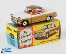 Corgi 231 Triumph Herald Coupe. boxed. Gold and white version with flat spun wheels in v light