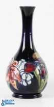 Moorcroft Orchid with spring flowers pattern vase, 26cm tall, signed on base by Walter Moorcroft -