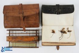 Charles Farlow black wallet with 6-sectioned parchment slots, with a large selection of flies to