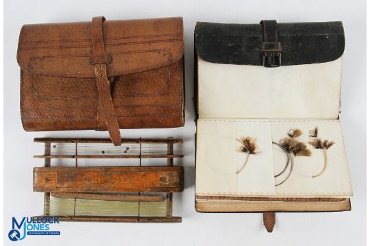 Charles Farlow black wallet with 6-sectioned parchment slots, with a large selection of flies to