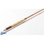 A 7' 2 piece impregnated split cane fly rod, butt section marked "Thomas Moran 7', #4/5, 3 3/4oz