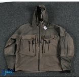 A green Simms multi pocket wading jacket, size large, polyester with Gore-Tex, drawstring hood and