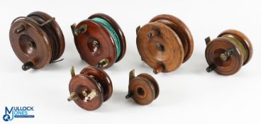 A collection of 7x brass/mahogany centre pin reels from 2" to 4" some with on/off checks and one