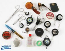 A collection of fly vest tools and treatments, as follows: Pocket watch style push button opening