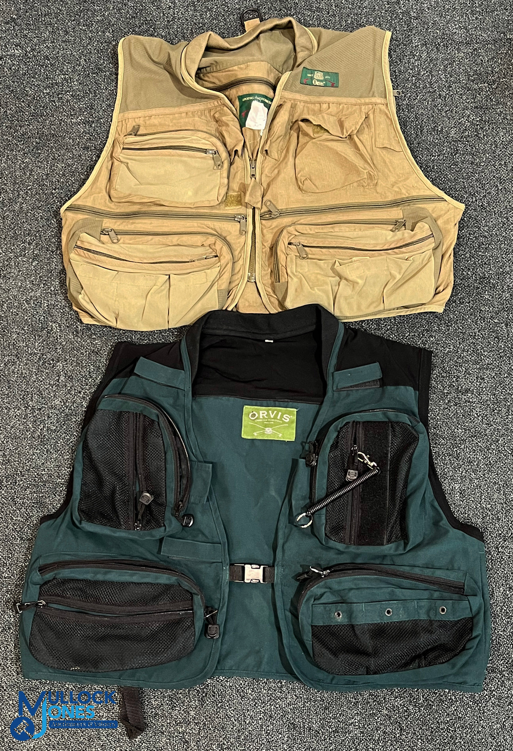 A pair of Orvis standard length fly vests, both size L, with good zips, fasteners and stitching,