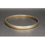 NINE CARAT GOLD BANGLE 7cm diameter and approximately 27.6 grams