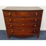 GEORGE III MAHOGANY BOW FRONT CHEST OF DRAWERS with three frieze drawers above three long drawers,