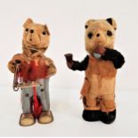JAPANESE TINPLATE CLOCKWORK BEAR reading a book and wearing a pair of dungarees, 18cm high, together