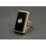 ART DECO BLACK AGATE AND DIAMOND DRESS RING the rectangular agate panel with central diamond, in