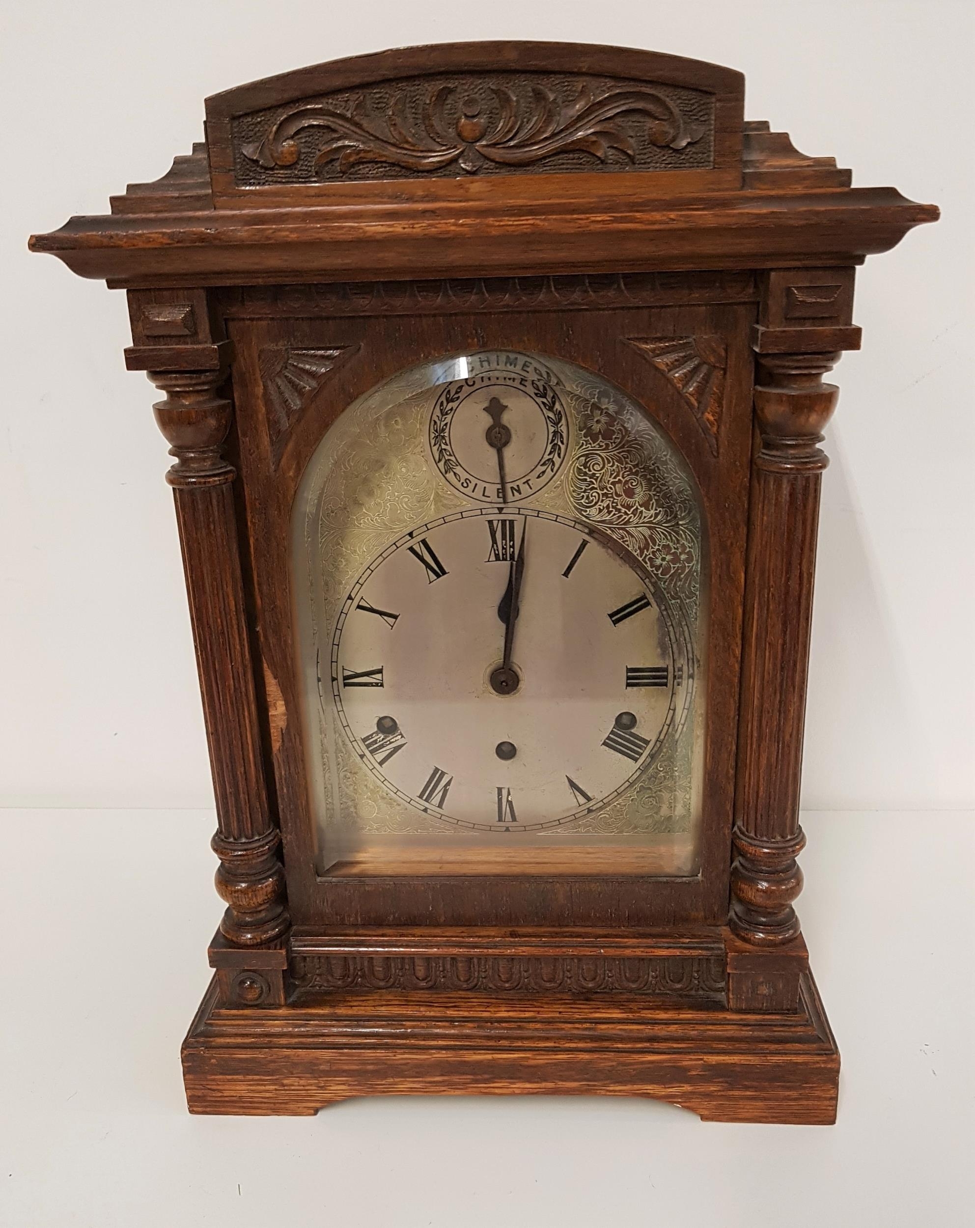 OAK CASED BRACKET CLOCK the circular silvered dial with Roman numerals and a Westminster chime 8 day