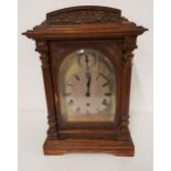 OAK CASED BRACKET CLOCK the circular silvered dial with Roman numerals and a Westminster chime 8 day