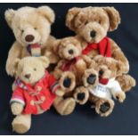 FIVE HOUSE OF FRASER TEDDY BEARS comprising the 2001 edition with a multi coloured scarf, 33cm high,