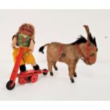 VINTAGE CLOCKWORK DONKEY with a fur covered body and a red bridle, 15.5cm high, together with a