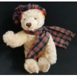 STEIFF MOHAIR GROWLER TEDDY BEAR with a tartan hat and scarf, jointed limbs and ear stud, numbered