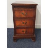 MAHOGANY AND CROSSBANDED SMALL CHEST OF DRAWERS with a moulded top above a pull out shelf and