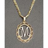 UNMARKED GOLD LETTER PENDANT with an italic 'M' within scroll border, on nine carat gold chain,