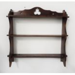 OPEN HANGING SET OF SHELVES with a carved and shaped top rail above three shelves, 66cm wide