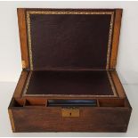 19th CENTURY MAHOGANY AND OAK WRITING SLOPE with brass corners, the lid opening to reveal a tooled