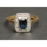 DIAMOND AND BLUE/GREEN SAPPHIRE CLUSTER RING the central sapphire in ten diamond surround, in