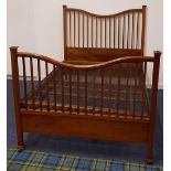 MAHOGANY DOUBLE BED with a shaped slatted head and foot board, with side supports and a sprung base,