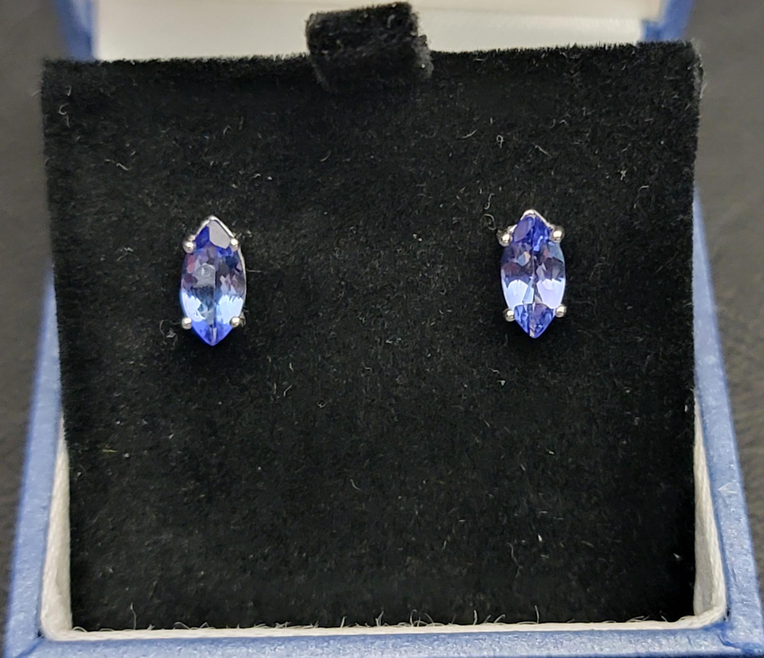 PAIR OF CERTIFIED TANZANITE STUD EARRINGS in nine carat white gold, the marquise cut AA+